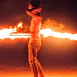 Koh Samet fire dancer on the beach at night.