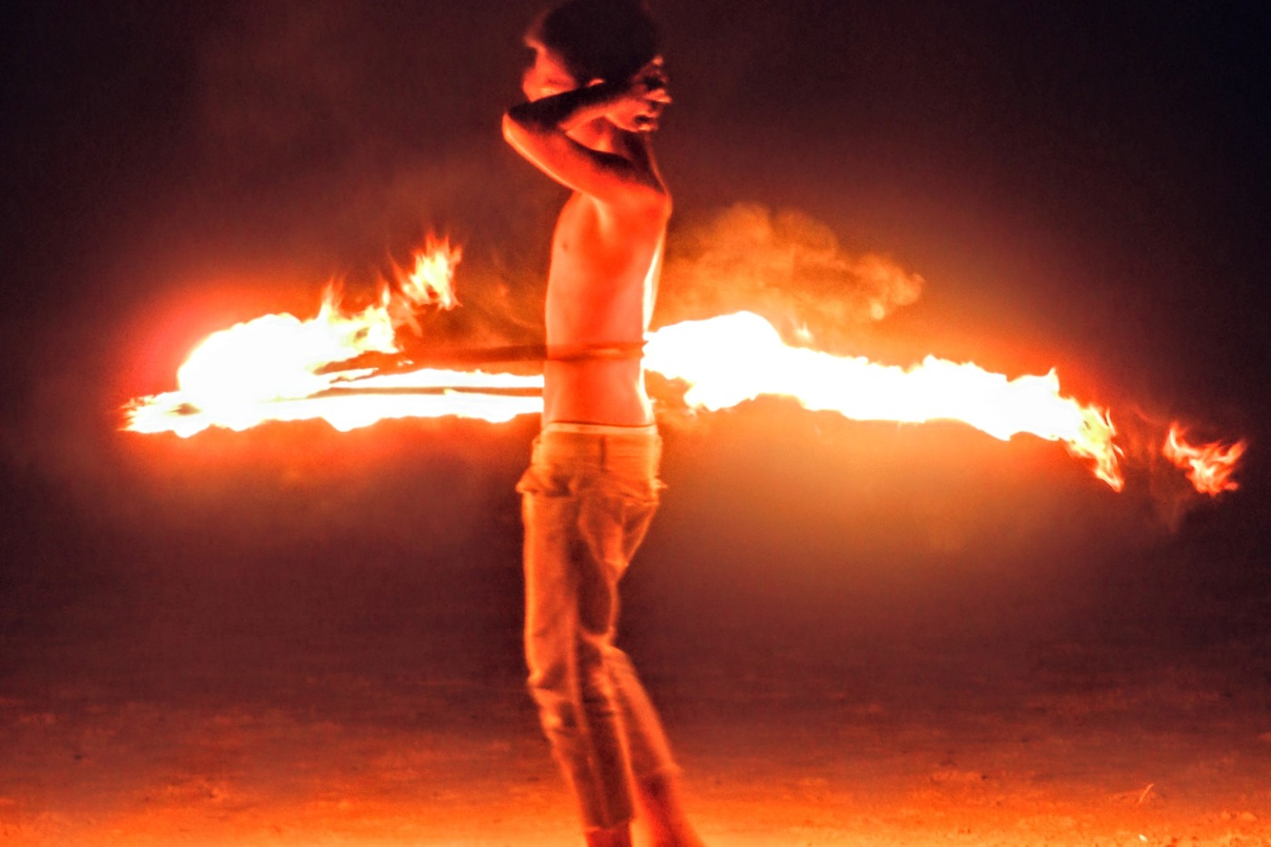 Koh Samet fire dancer on the beach at night.