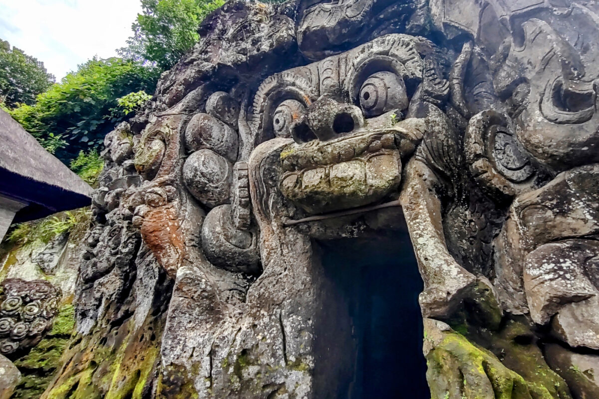 Goah Gavah Elephant Cave. The carved entrance to a small cave, showing a monstrous face and fingers coming out of the rock.