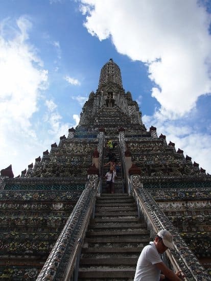 Climbing the prangs at wat arun