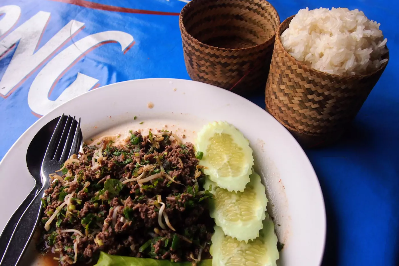 Laos food larp and sticky rice in traditional steamer