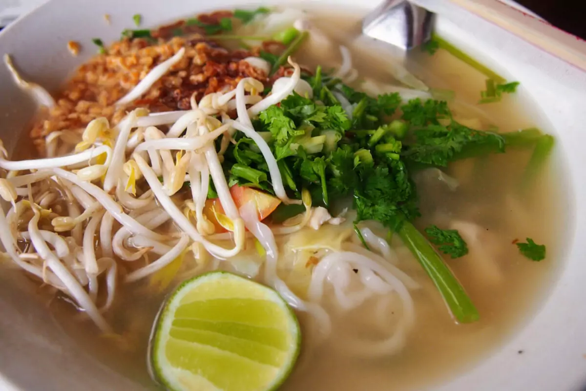 Laos noodle soup bowl with beansprouts and lime.