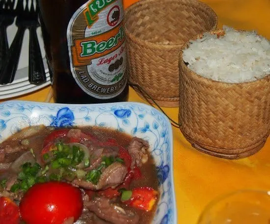 Laos curry with sticky rice and beer Lao. Food in Laos
