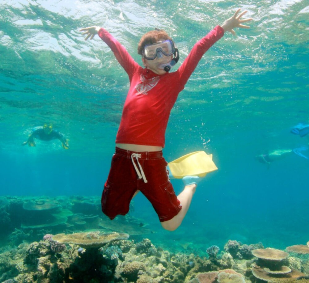 kid australia snorkelling great barrier reef