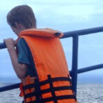 child looking for whales on a whale watching trip from Mirissa Sri Lanka