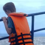 child looking for whales on a whale watching trip from Mirissa Sri Lanka