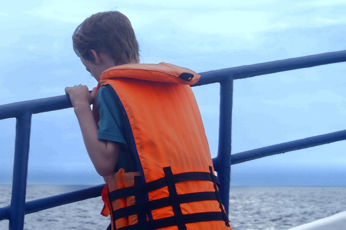 child looking for whales on a whale watching trip from Mirissa Sri Lanka