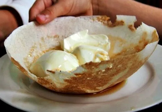 Hoppers Sri Lanka. Desert with curd and trickle.