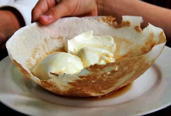 Hoppers Sri Lanka. Desert with curd and trickle.