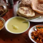 Sri Lankan foods, string hoppers, hoppers, roti, dal, coconut sambol and egg curry.