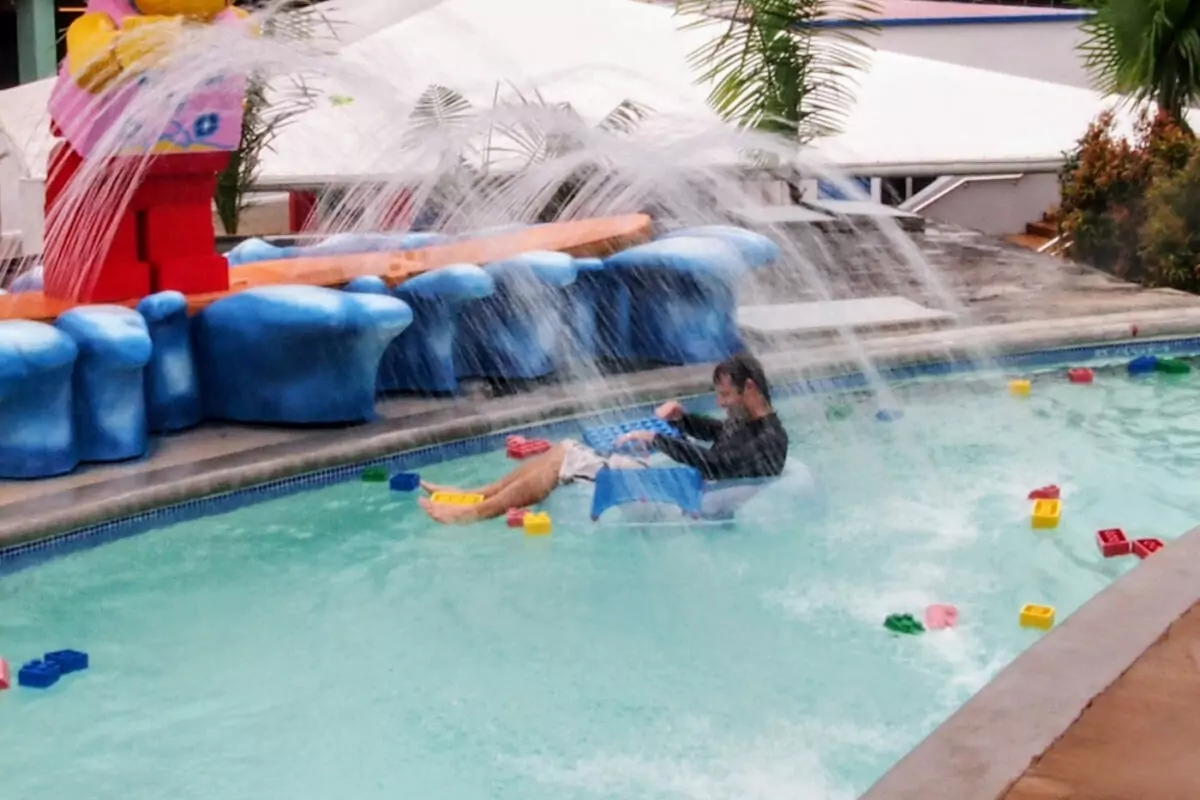 Man in the water with floating lego at legoland water park malaysia