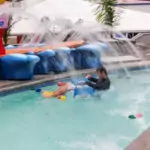 Man in the water with floating lego at legoland water park malaysia