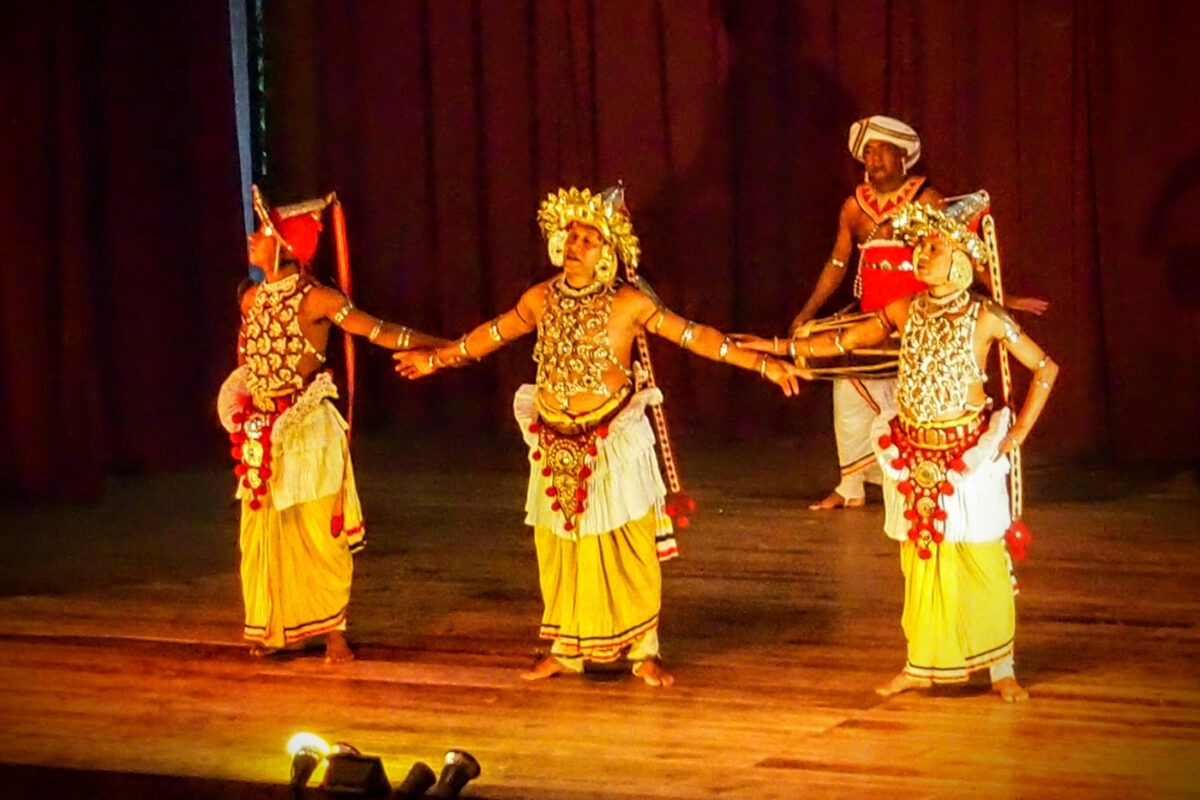 Kandy dance performance on stage.