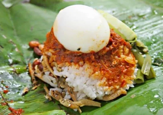 Nasi Lamak in Malaysia. Fat rice, with egg, anchovies peanuts and sambol