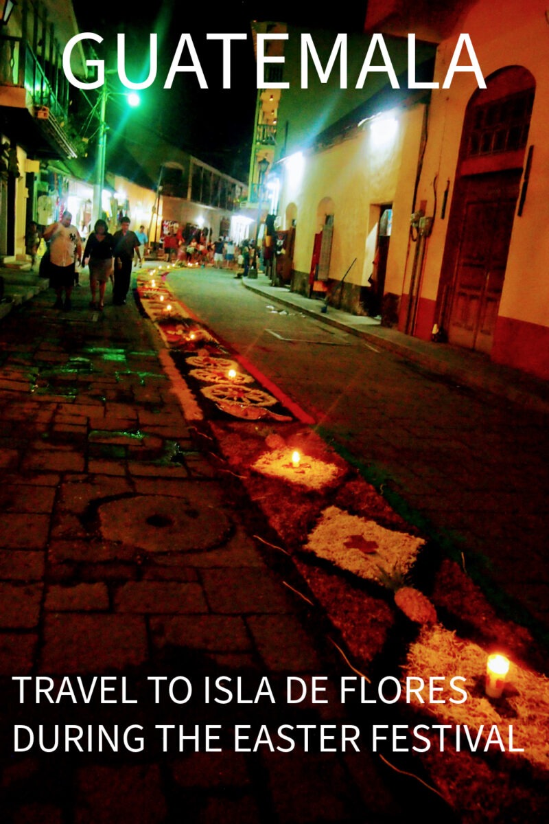 Street scene in Flores Guatemaa at night during Easter Festival showing candles and flower carpets