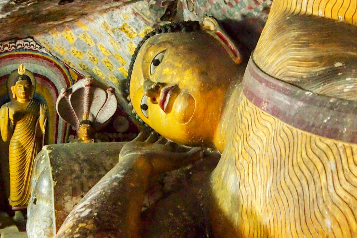 reclining golden Buddha inside the Dambulla Cave Temples in Sri Lanka