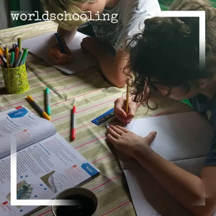 Worldschoolers doing written work. Curriculum
