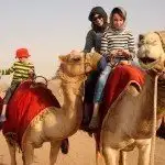 A Camel Safari in the desert. Dubai family fun travel.