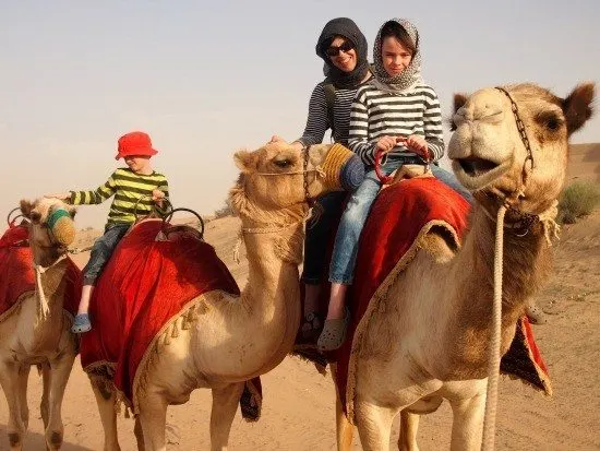 Dubai camel safari in the desert. Family fun on a camel safari.