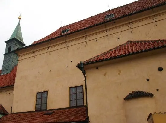 Highlights of Prague for kids. Cannonballs in the wall on a Prague Tour 
