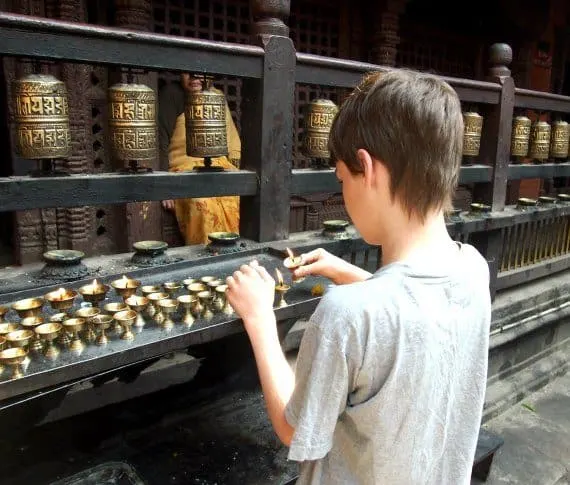 The Golden Temple. Lighting Candles Patan Durbar Square Kathmandu, Nepal