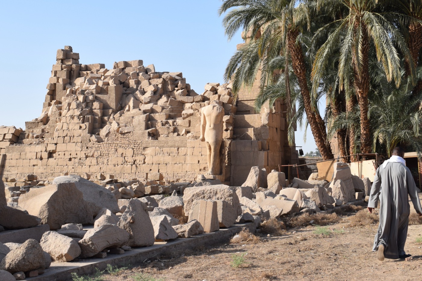 Man walking in the Egyptian ruins in Luxor