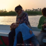 Family on a sunset felucca sail on the Nile