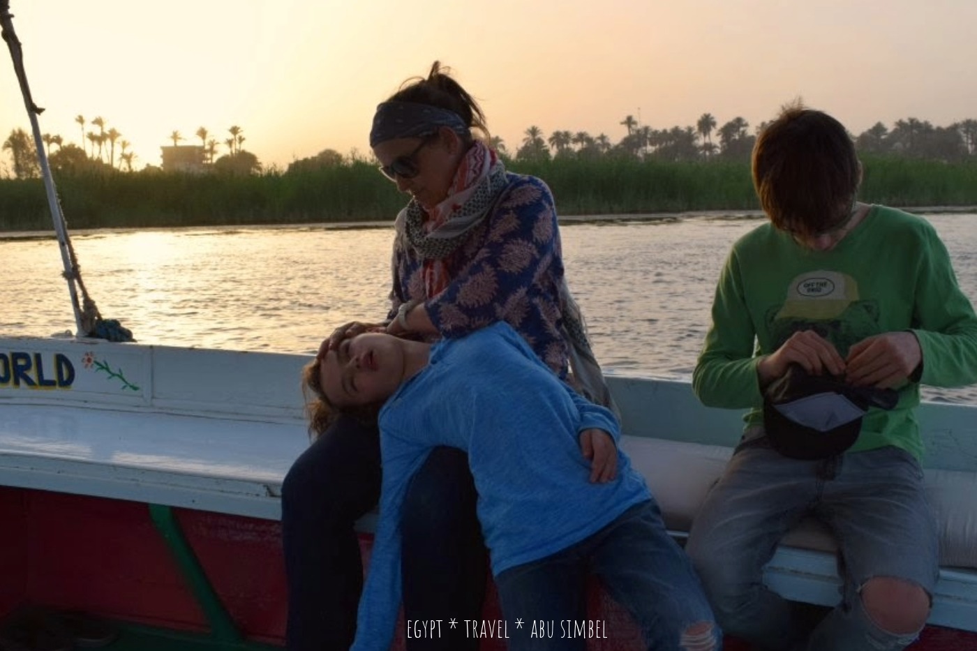 Family on a sunset felucca sail on the Nile