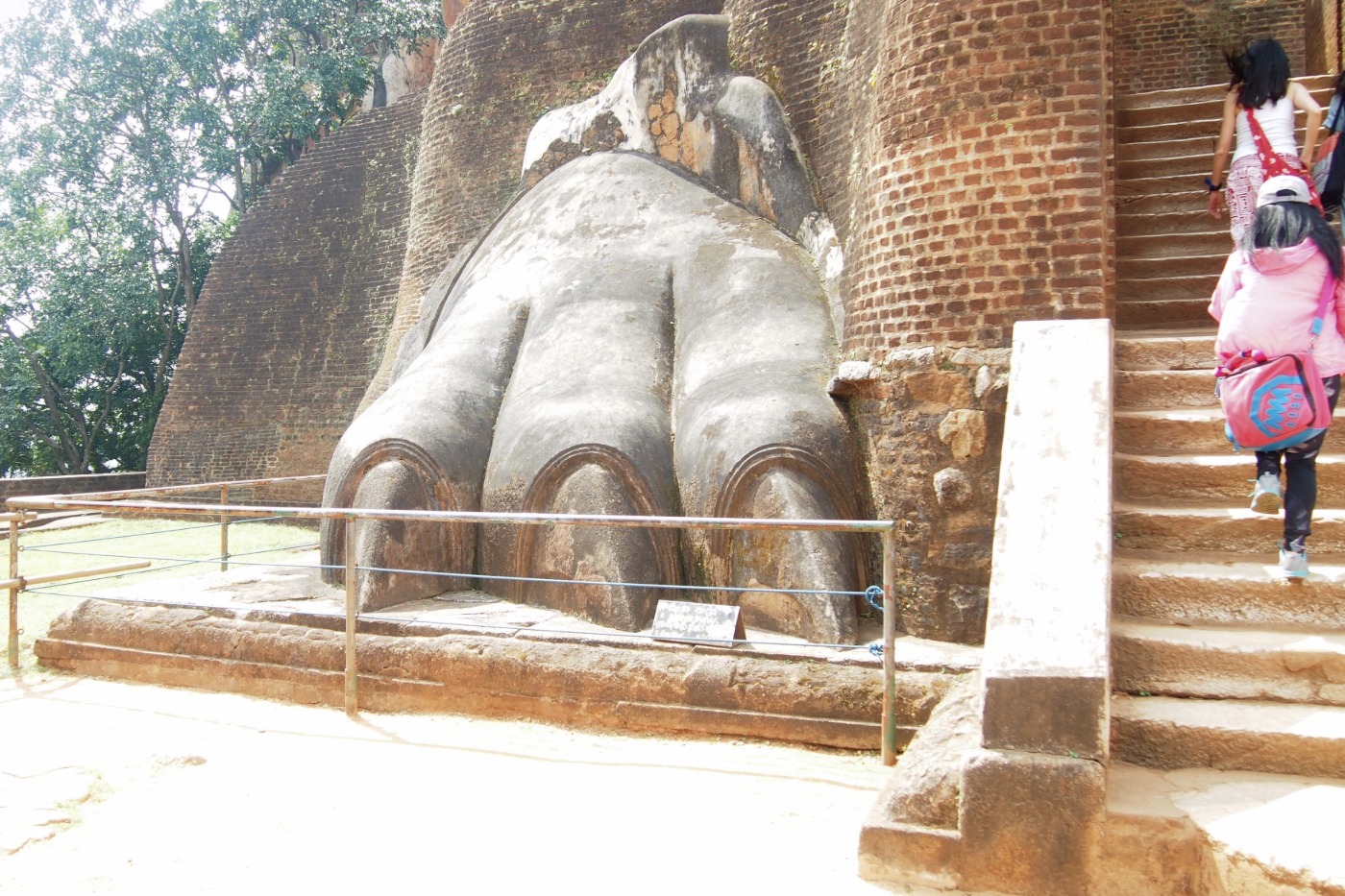 lion paws and steps at Sigiriya Sri Lanka. Child climbing steps.