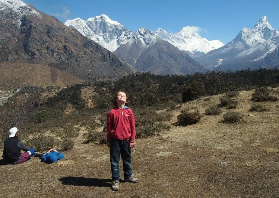 Staying fit while travelling walking. Child near Everest Nepal trek