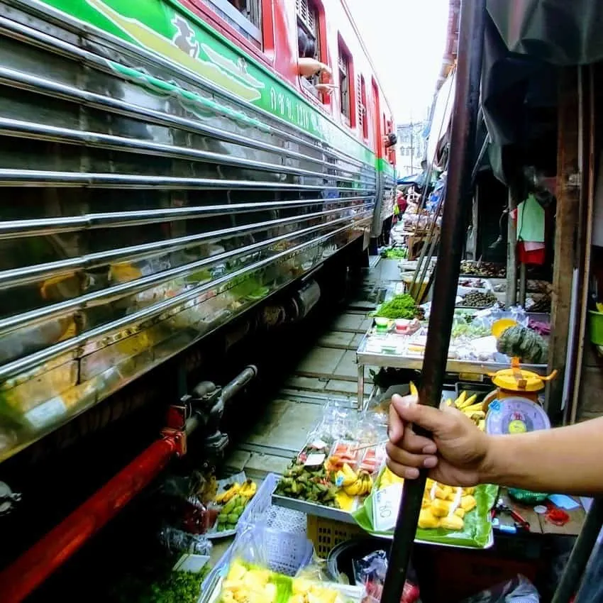 Maeklong Railway Market between trains