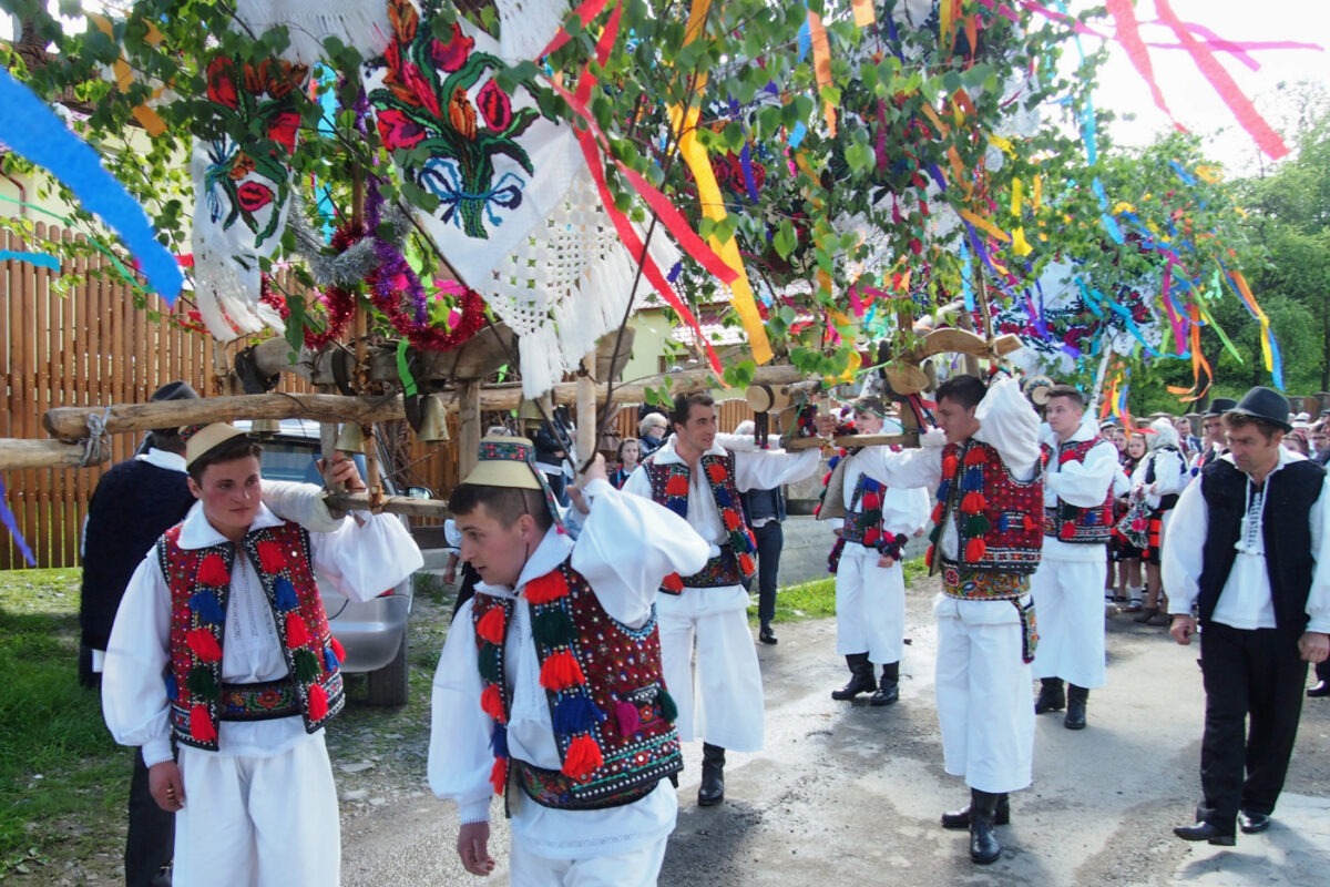 traditional romanian costume. men taking part in the ploughing festival in hoteni maramures