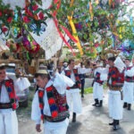 traditional romanian costume. men taking part in the ploughing festival in hoteni maramures