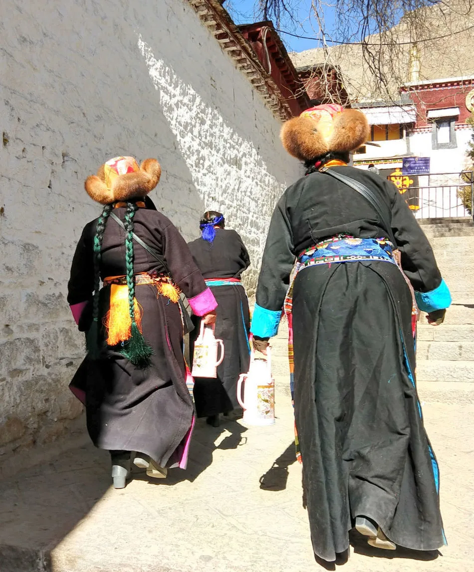 Women in traditional Tibetan costume at the Sera Monastery