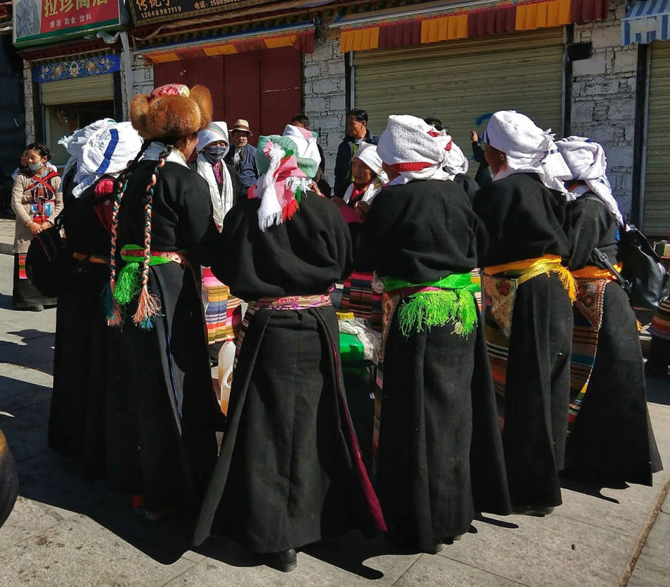 Women singing and dancing outside the Sera Monastery, before or after making their kora