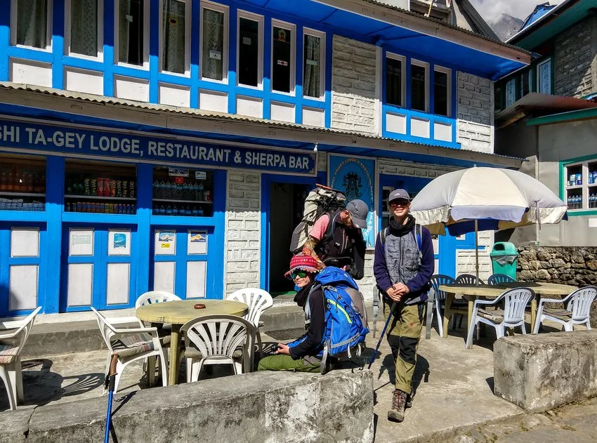 trekkers outside a typical trekking lodge or tea house Nepal