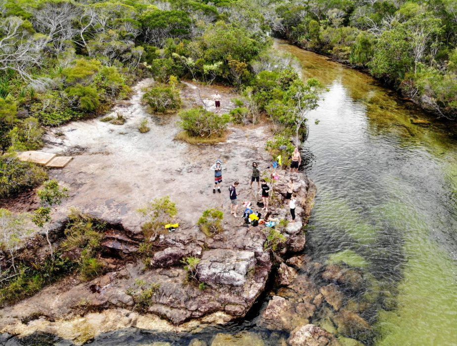Travel with teenagers group tour flying a drone over fruitbat falls