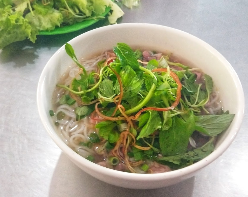 A bowl of Bun Bo Hue Beef Noodle Soup Served in Hue Vietnam