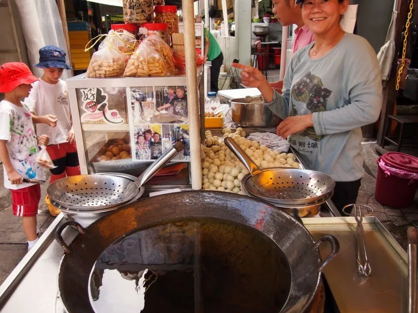 Children eating street food China Town Kuala Lumpur with Kids