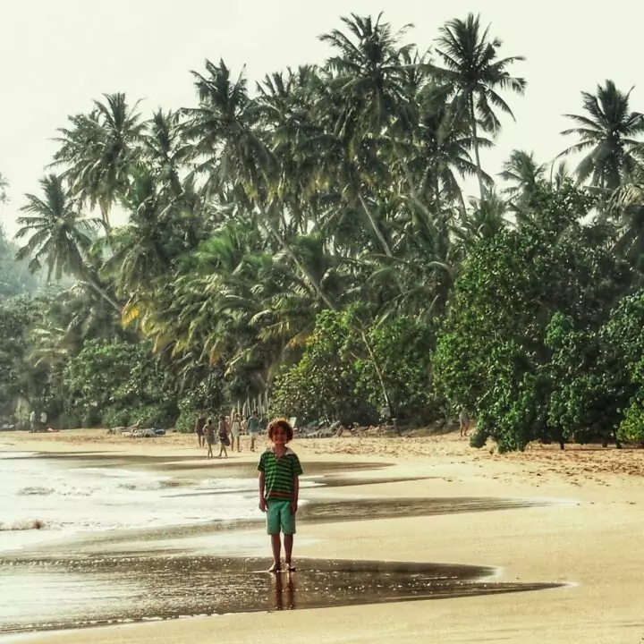 Child on a beach in Sri Lanka. Sri Lanka as a travel destination
