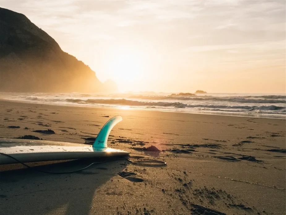 surf board on beach surfing lessons for kids