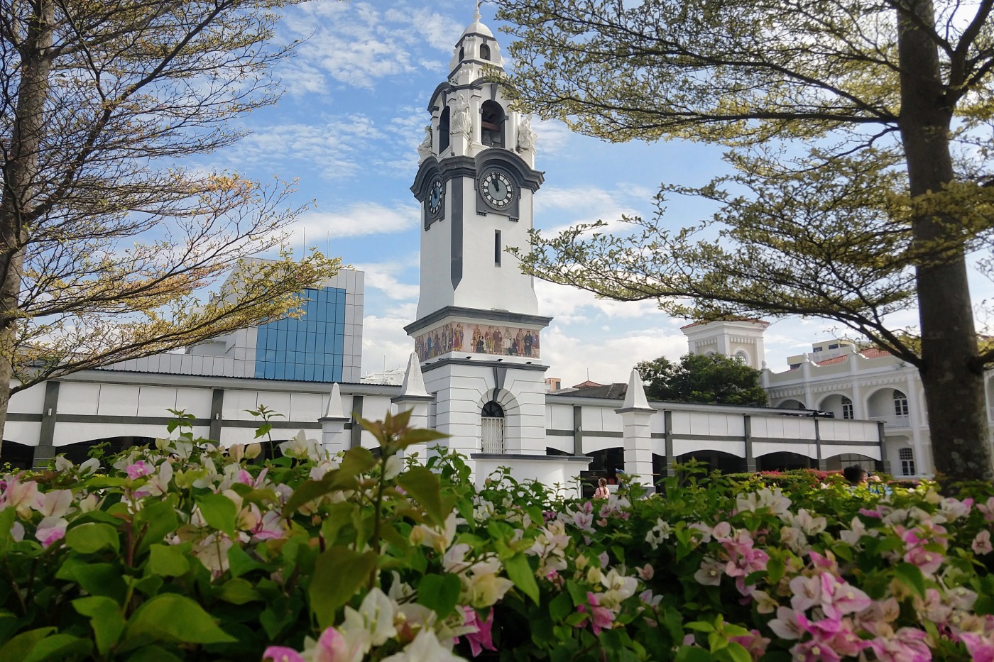 ipoh malaysia pretty white clock tower and flowers