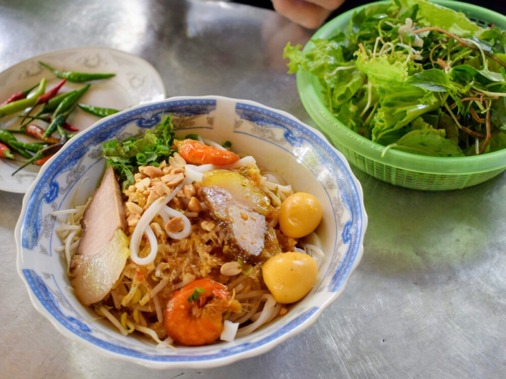 Best food in Hoi An mi quang noodles photos quail egg, prawn, pork noodles.