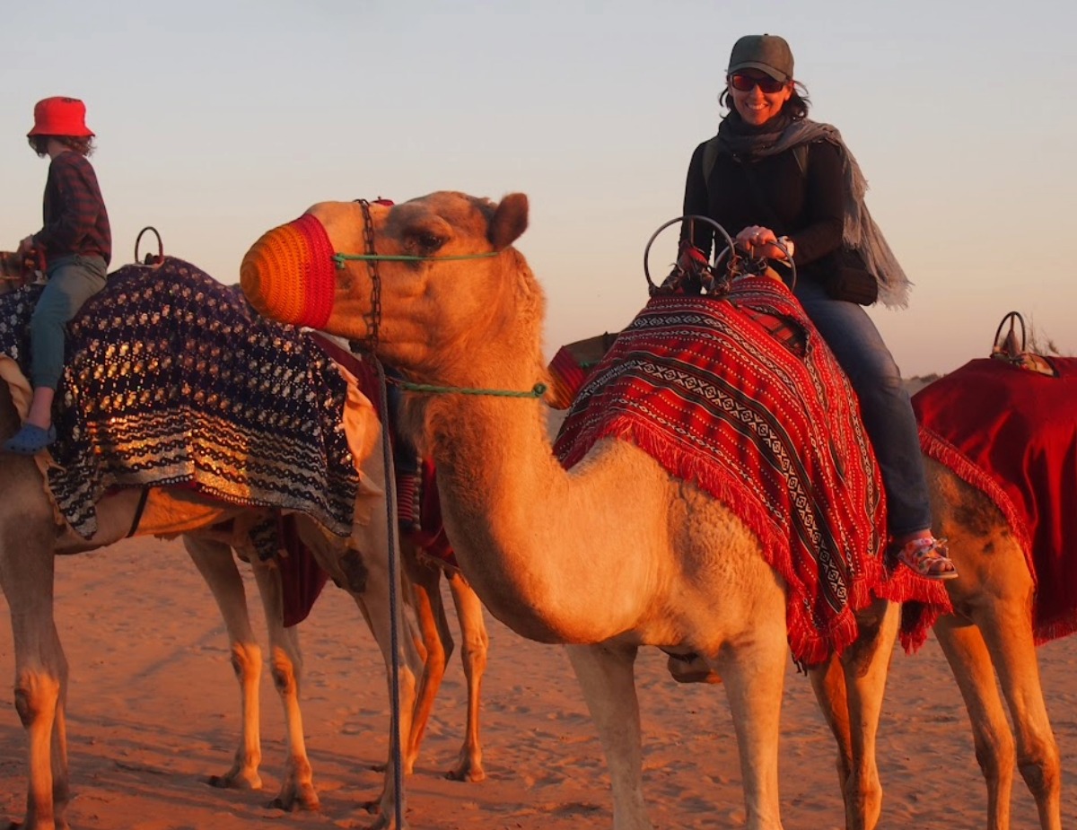 Dubai travel blog riding camels Dubai desert