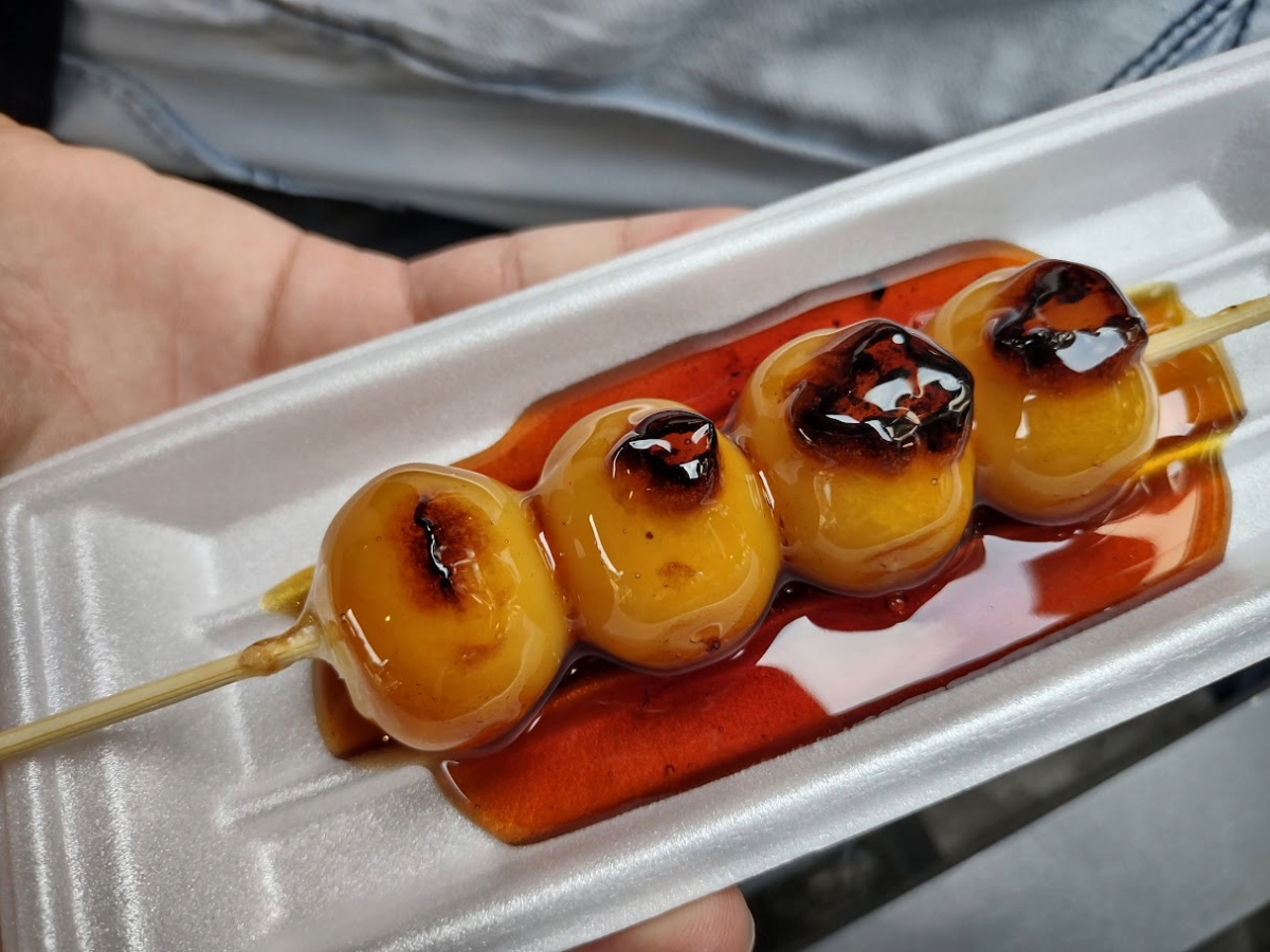 Japanese street food. Rice balls in syrup.