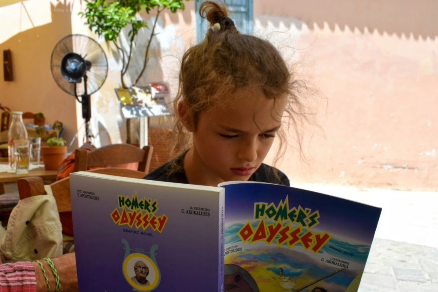 Worldschooling child reading a book