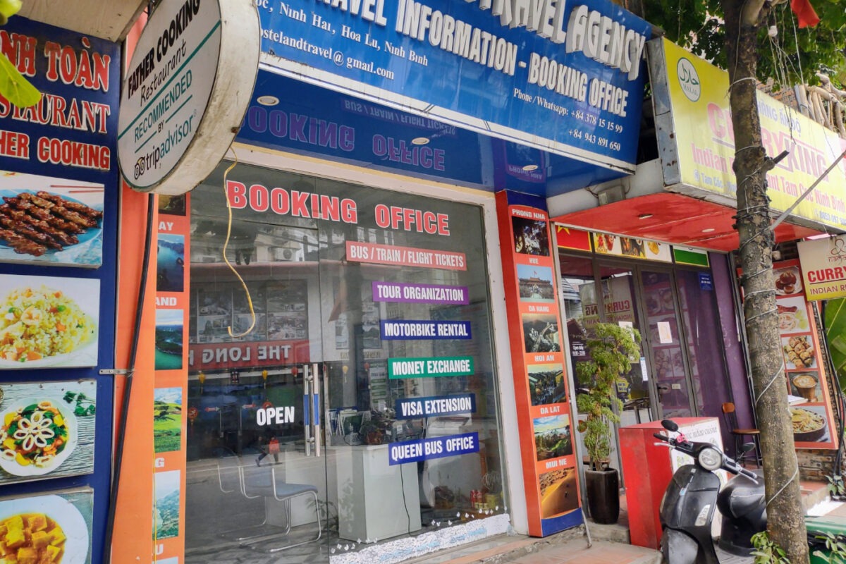 Travel booking office shop exterior on the street, Vietnam.