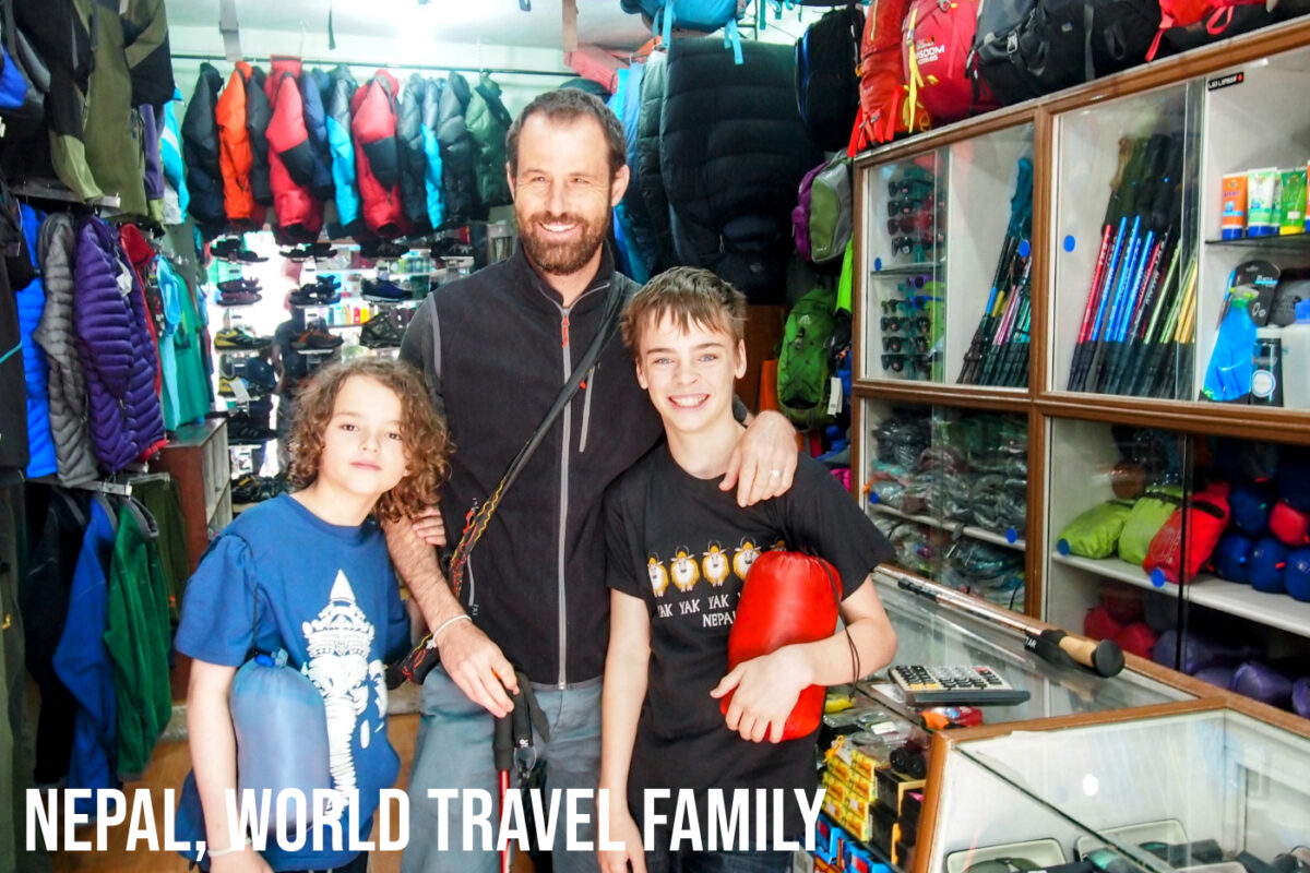 World Travel family shopping in a trekking store in Thamel Nepal, buying trekking gear